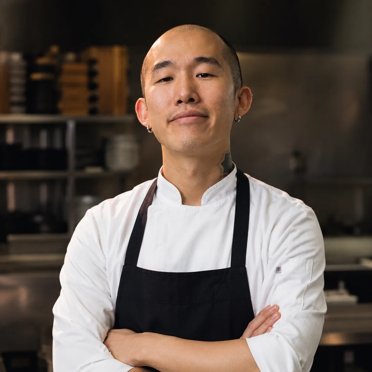 Portrait of private chef Teo Kim in a professional kitchen