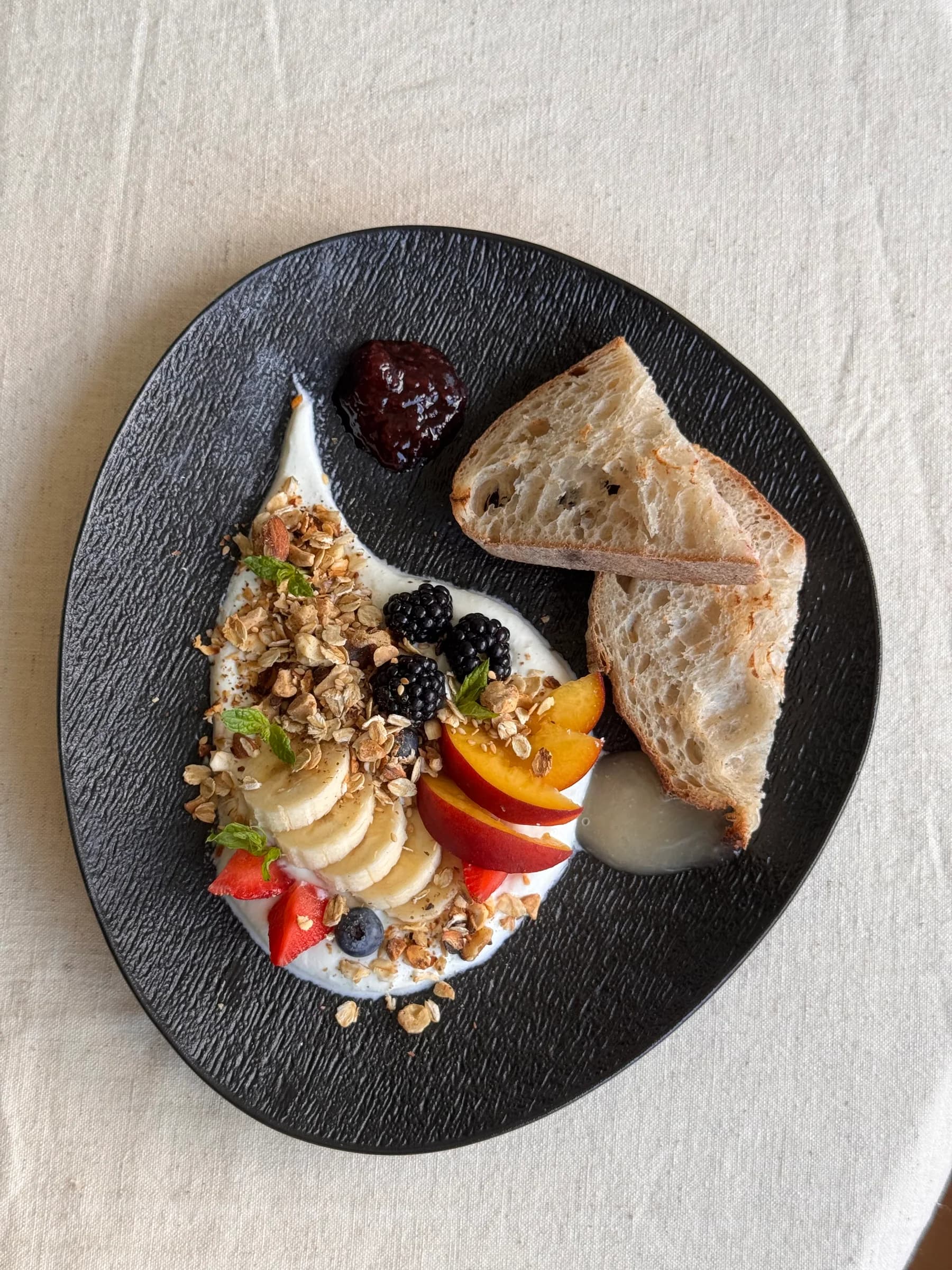 Fresh fruit, yoghurt and granola prepared for household breakfast