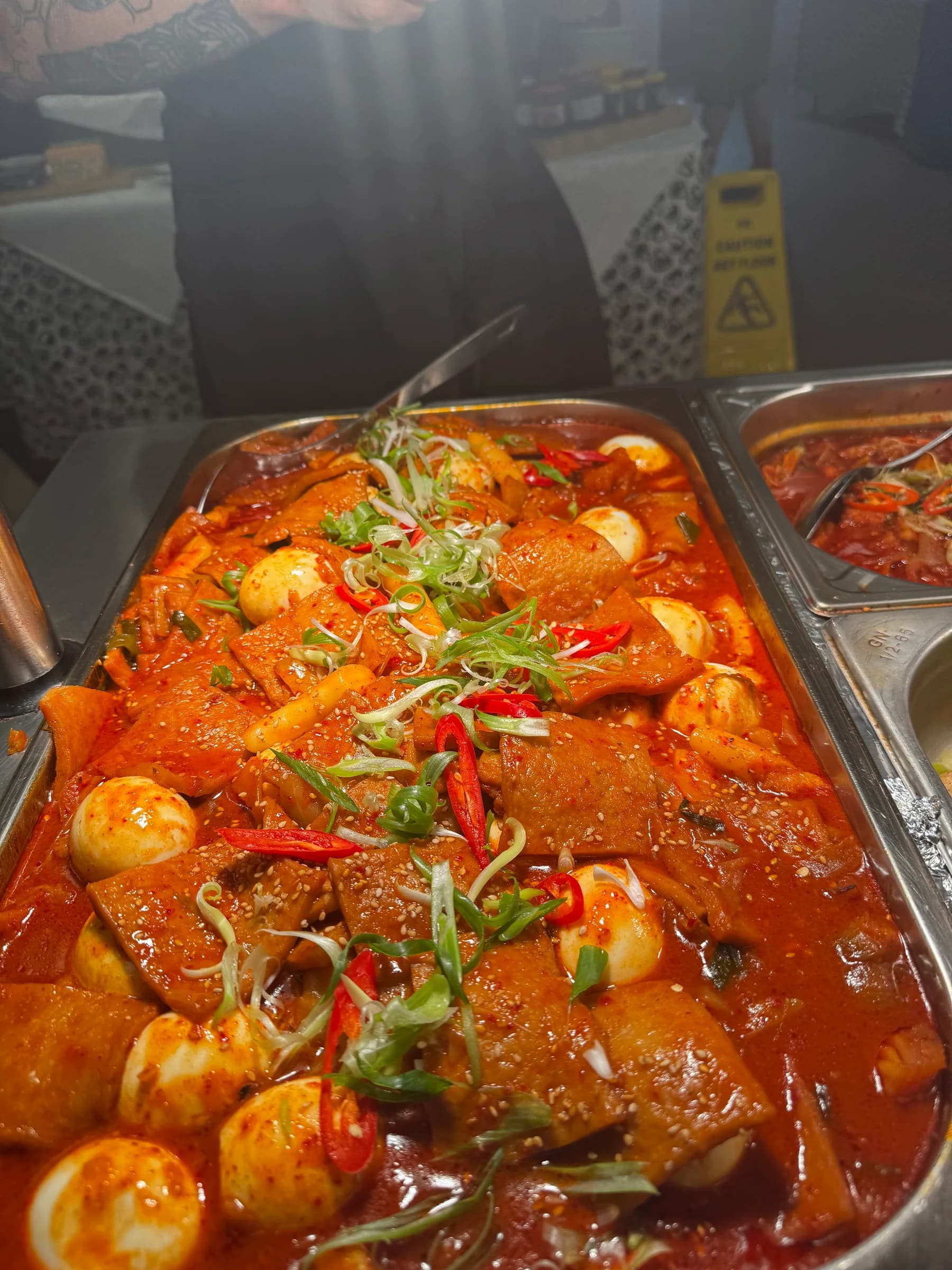 Korean hot dishes ready for buffet service